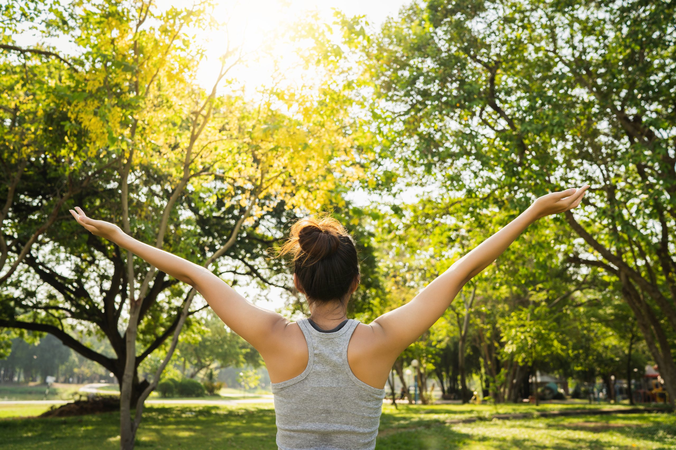 Healthy young Asian runner woman warm up the body stretching bef
